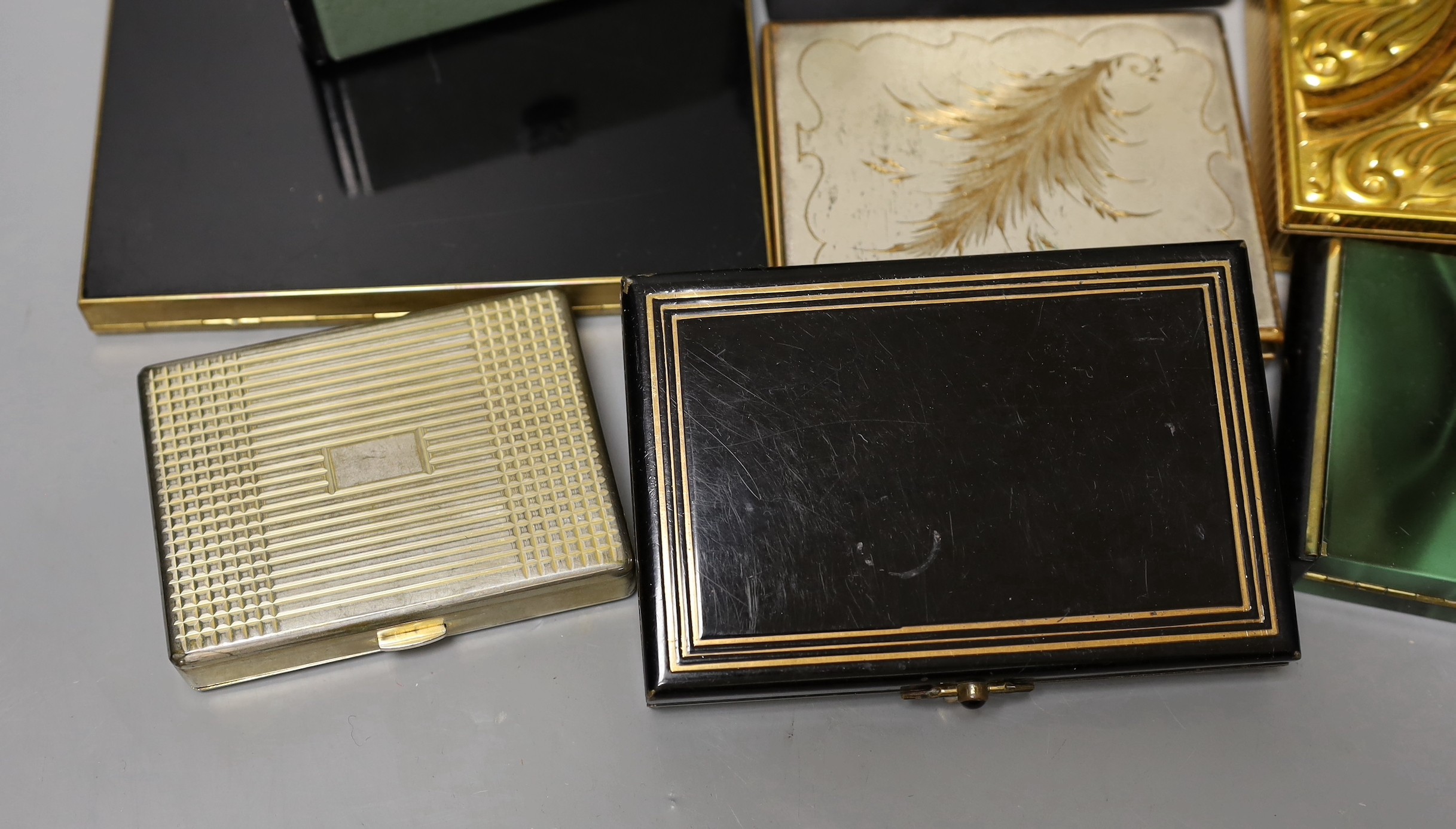 A collection of nine metal 1930’s and later ladies evening minaudière, two with handles, five enamelled, largest 15 cms x 12 cms
